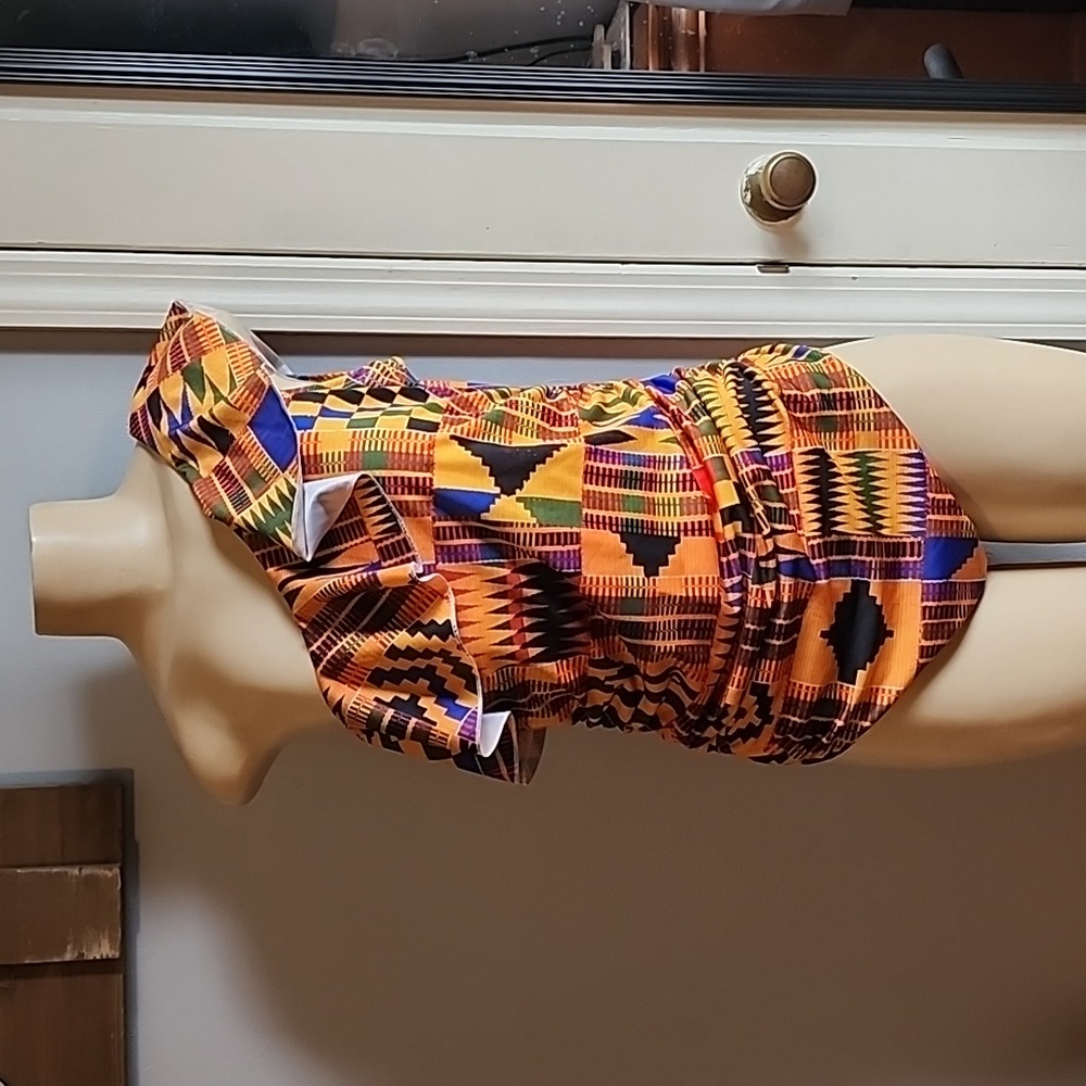 NWOT Beautiful Never Worn African Kente cloth print one-piece.